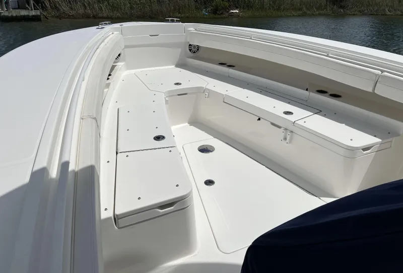 Slide: The Image of 2022 Regulator 31 boat interior with spacious seating and storage compartments. - 5