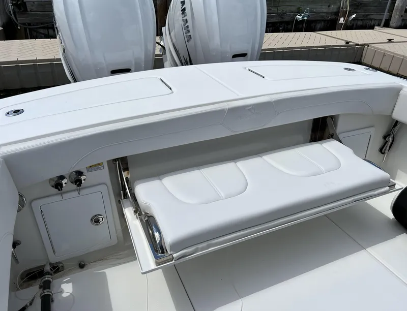 Slide: The Image of 2022 Regulator 31 boat with foldable seating and dual outboard engines. - 6