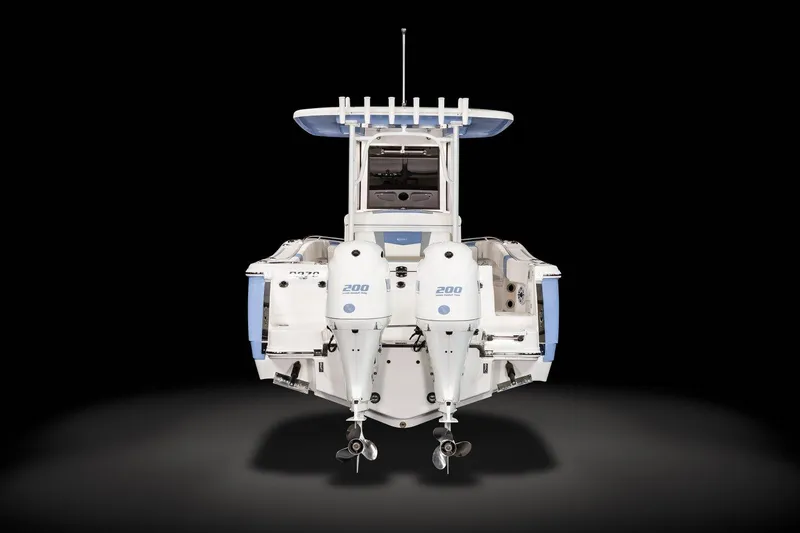 Slide: The Image of 2023 Robalo R270 boat, rear view with dual engines, on a black background. - 9