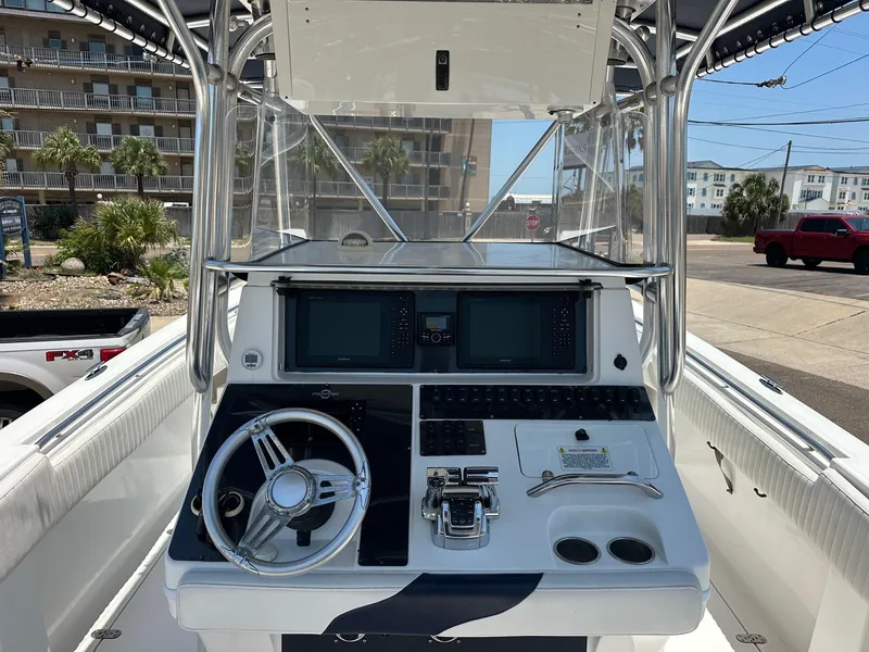 Slide: The Image of 2008 Fountain Center Console boat dashboard with steering wheel and controls. - 6