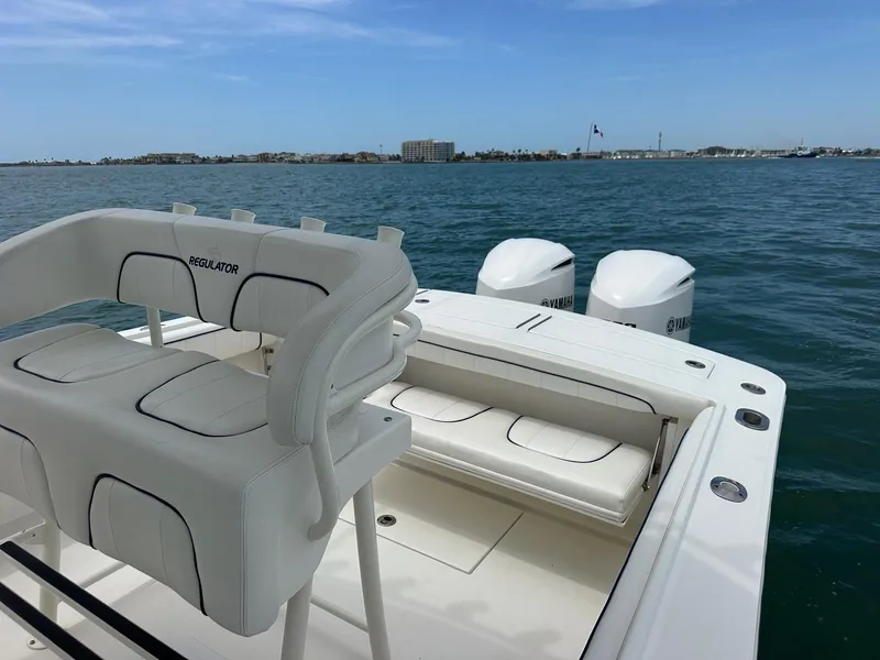 Slide: The Image of 2016 Regulator center console boat with Yamaha engines on open water. - 10