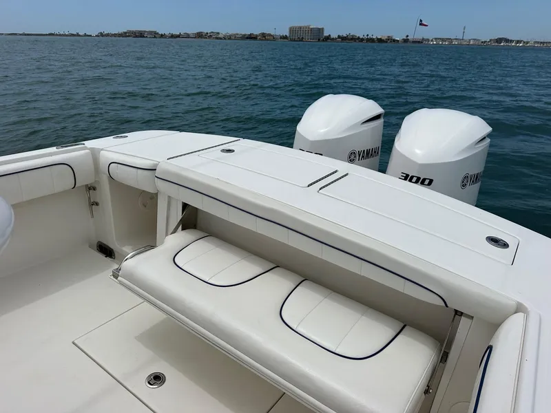 Slide: The Image of 2016 Regulator center console boat with Yamaha 300 engines on open water. - 12