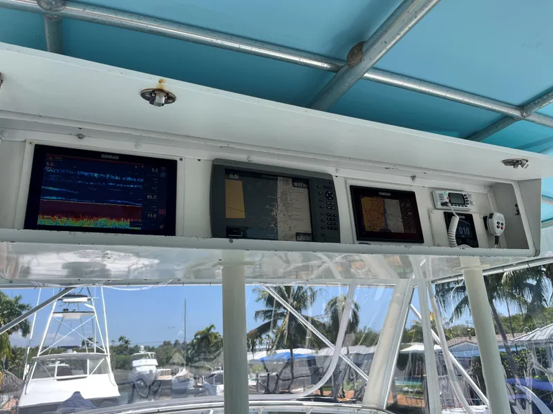 Slide: The Image of Control panel of a 1983 Bertram 46 Convertible boat with navigation screens. - 11