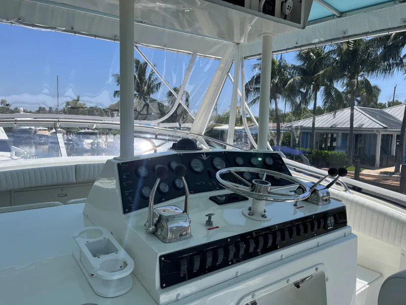 Slide: The Image of Helm of 1983 Bertram 46 Convertible yacht with steering wheel and controls. - 12