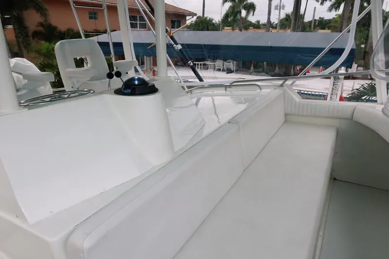 Slide: The Image of 1983 Bertram 46 Convertible yacht deck with seating and navigation equipment. - 14