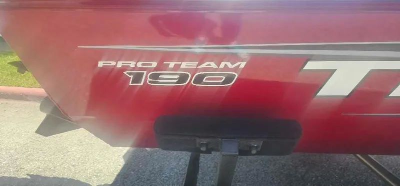 Slide: The Image of 2025 Tracker Pro Team 190 boat, red exterior with model branding. - 2
