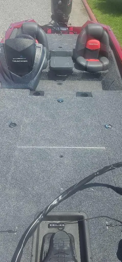 Slide: The Image of 2025 Tracker Pro Team 190 boat interior with seating and carpeted deck. - 3