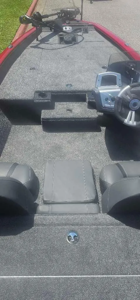 Slide: The Image of 2025 Tracker Pro Team 190 boat interior with steering console and seating. - 4