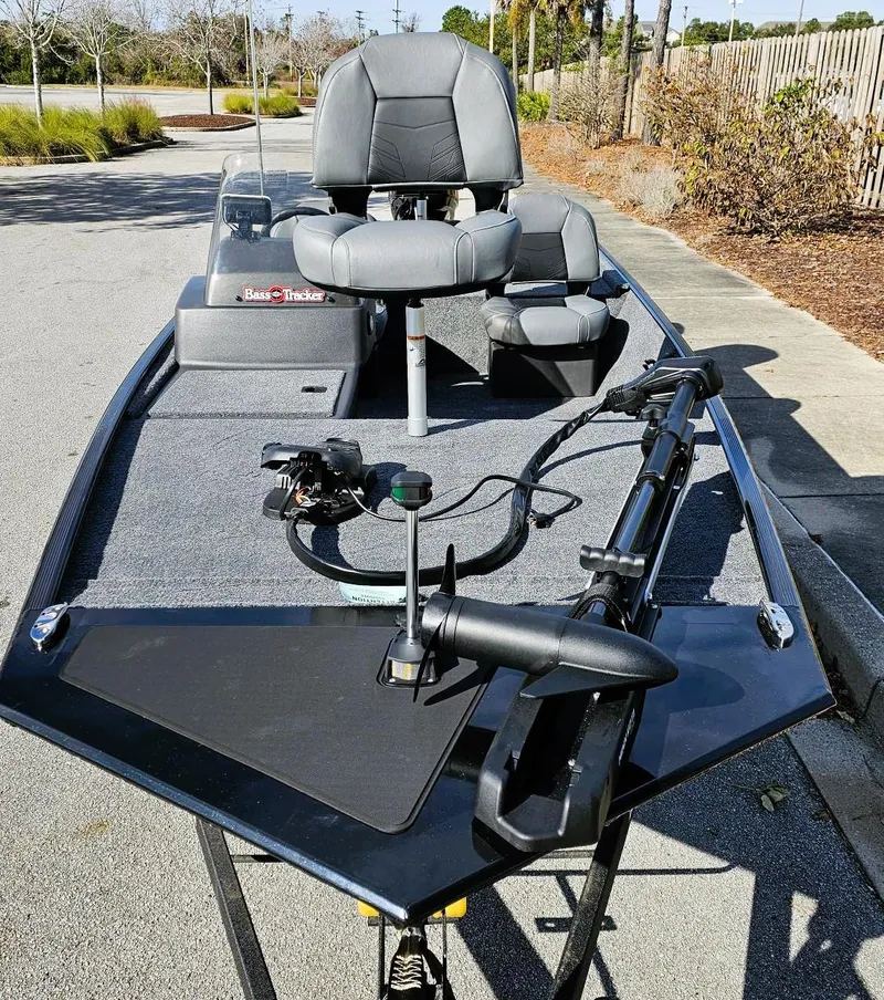 Slide: The Image of 2025 Tracker Bass Tracker Classic XL boat with seating and fishing equipment. - 4