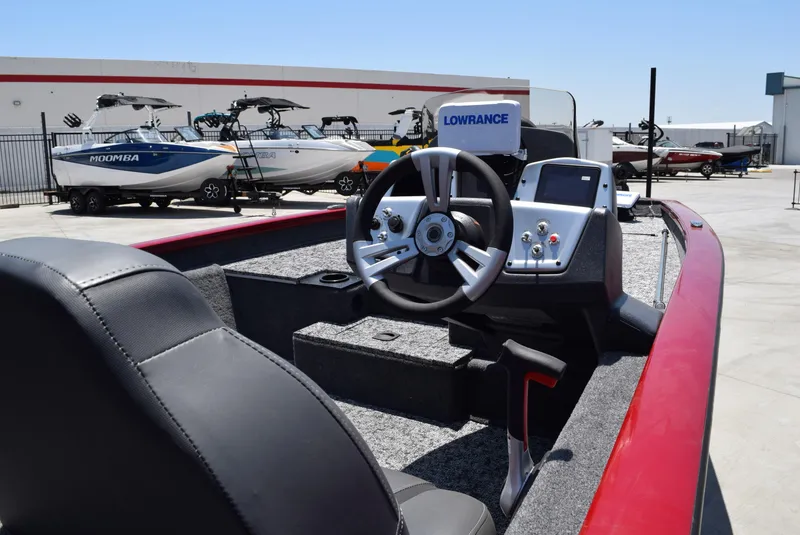Slide: The Image of 2025 Tracker Pro Team 175 boat interior with steering wheel and control panel. - 2
