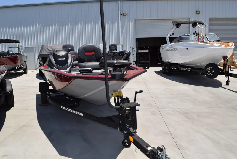 Slide: The Image of 2025 Tracker Pro Team 175 boat on trailer in outdoor showroom. - 7