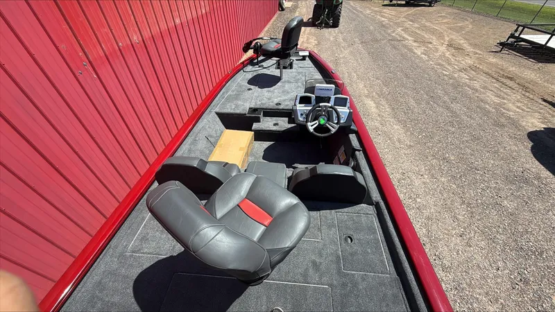 Slide: The Image of 2025 Tracker Pro Team 190 boat interior with steering console and seating. - 3