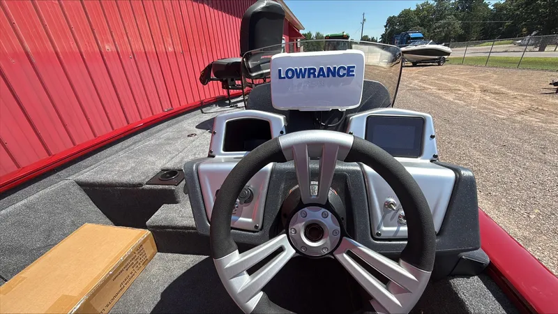 Slide: The Image of 2025 Tracker Pro Team 190 boat dashboard with Lowrance electronics and steering wheel. - 4