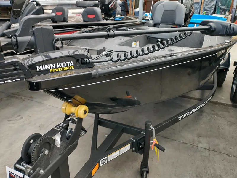 The Image of 2025 Tracker Super Guide V-16 T boat with Minn Kota PowerDrive motor on trailer. - 0