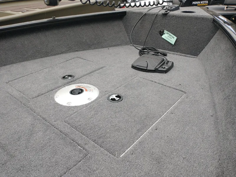 Slide: The Image of 2025 Tracker Super Guide V-16 T boat interior with Minn Kota trolling motor. - 2