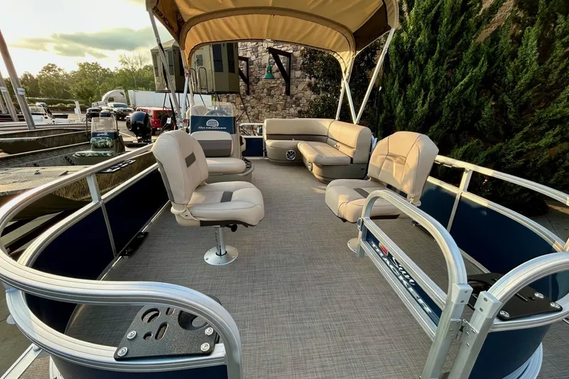 Slide: The Image of 2025 Sun Tracker Bass Buggy 16 XL Select pontoon boat with spacious seating and canopy. - 3