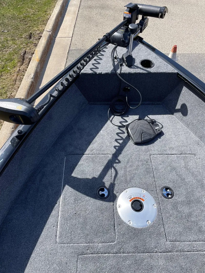 Slide: The Image of 2025 Tracker Super Guide V-16 SC boat deck with trolling motor and foot pedal. - 3