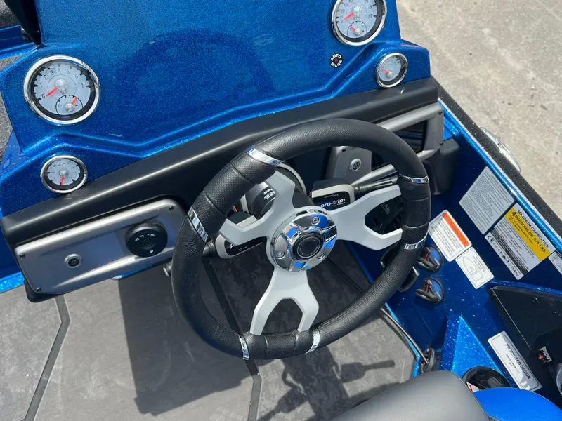 Slide: The Image of Steering wheel and dashboard of 2025 Nitro Z20 XL boat, featuring gauges and controls. - 10