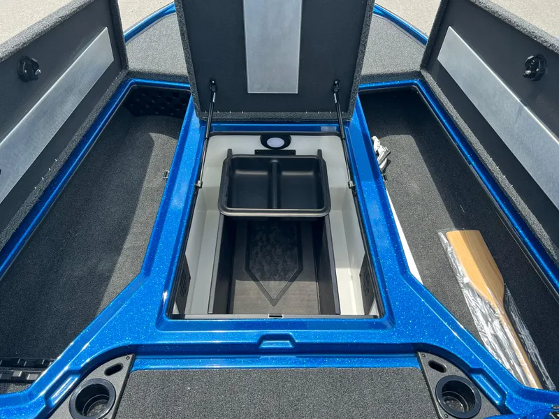 Slide: The Image of 2025 Nitro Z20 XL boat storage compartment with blue trim and organized interior. - 6