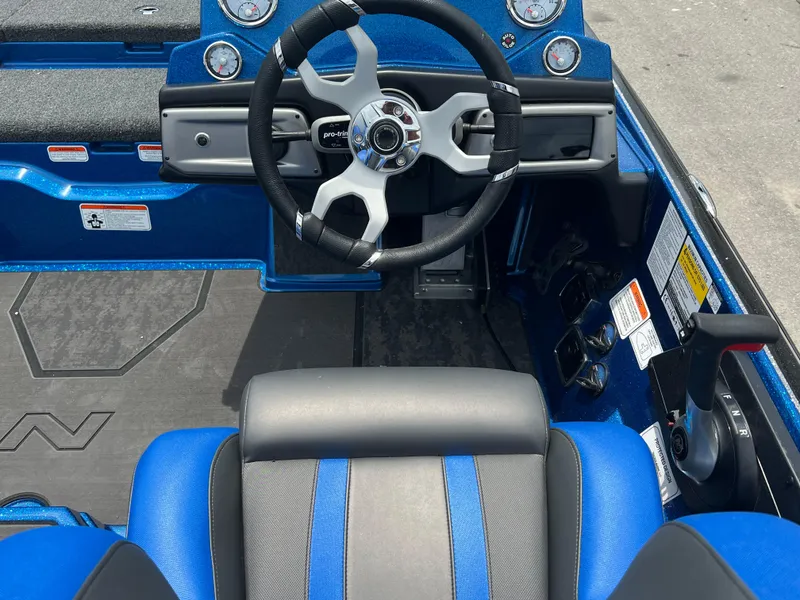 Slide: The Image of 2025 Nitro Z20 XL boat cockpit with steering wheel and control panel. - 9