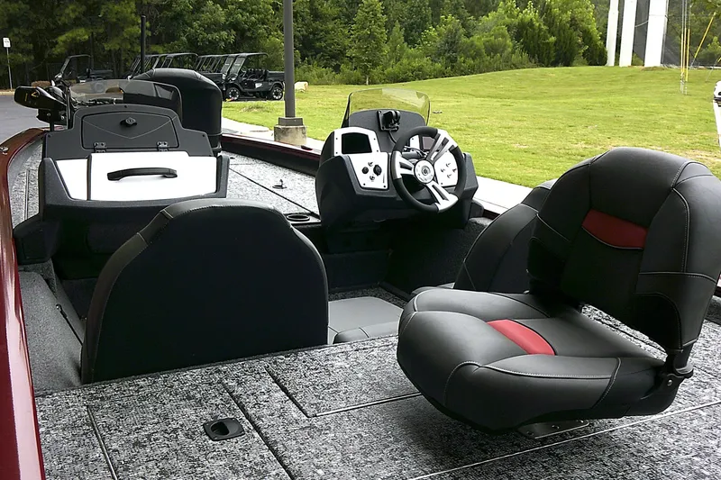 Slide: The Image of 2025 Tracker Pro Team 190 boat interior with modern seating and steering console. - 3