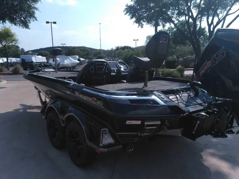 Slide: The Image of 2025 Ranger Z521R Cup-Equipped boat in a parking lot, showcasing sleek design and features. - 2