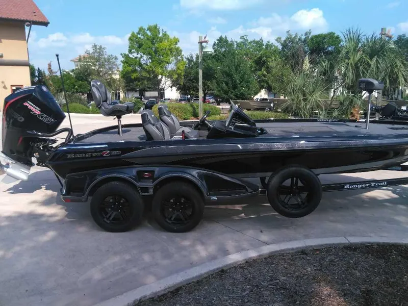 Slide: The Image of 2025 Ranger Z521R Cup-Equipped boat on trailer, parked outdoors. - 4