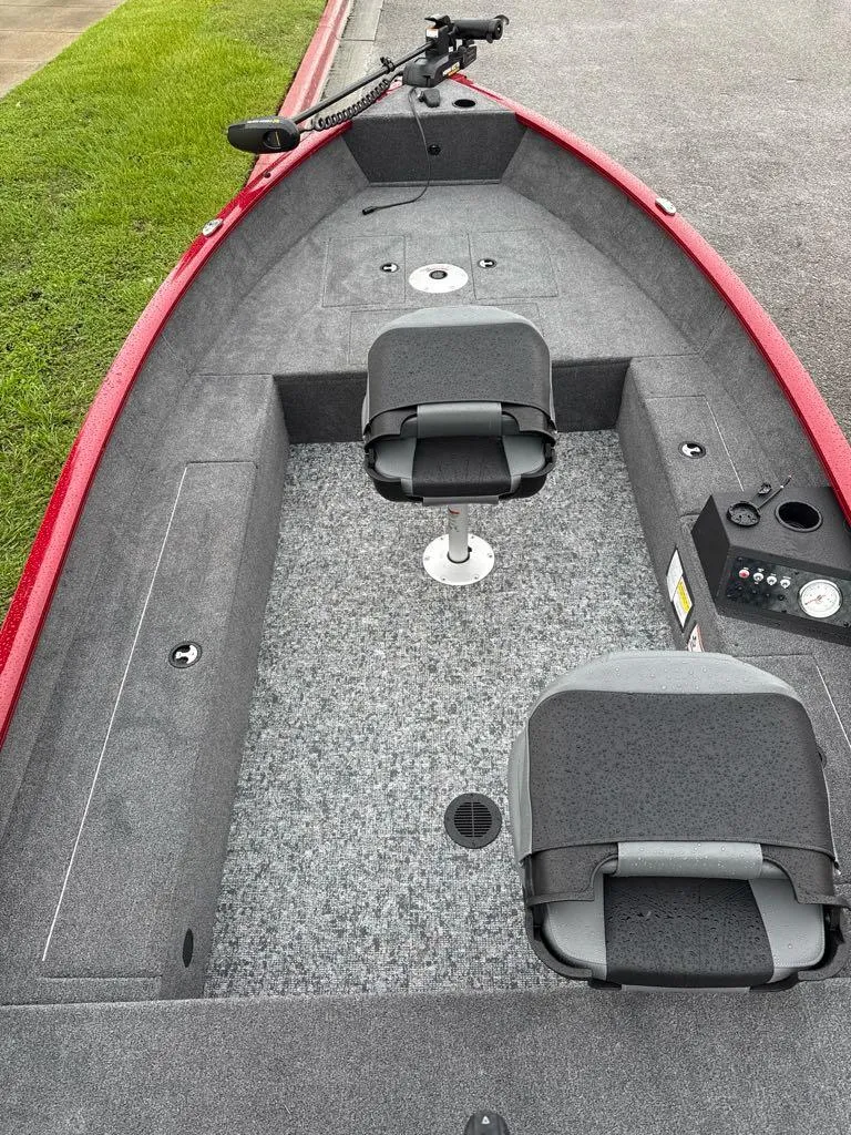 Slide: The Image of 2025 Tracker Super Guide V-16 T boat interior with seating and controls. - 4