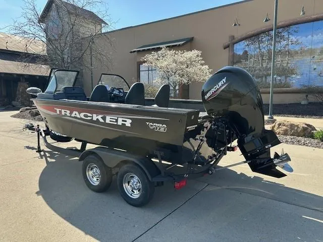 Slide: The Image of 2025 Tracker Targa V-18 WT boat on trailer, parked outdoors. - 2