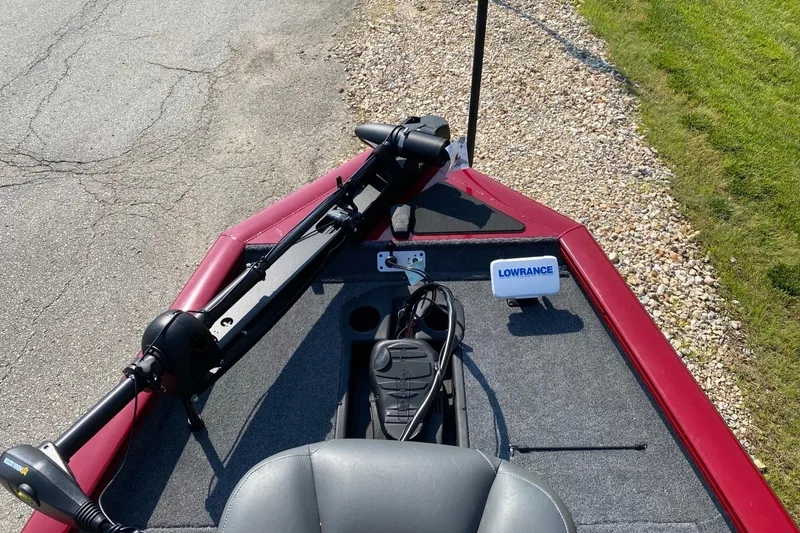 Slide: The Image of 2025 Tracker Pro Team 175 boat with trolling motor and Lowrance fish finder on deck. - 2