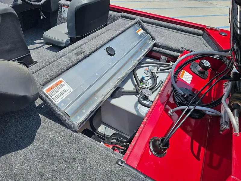 Slide: The Image of 2025 Tracker Pro 170 boat interior showing fuel tank and storage compartment. - 11