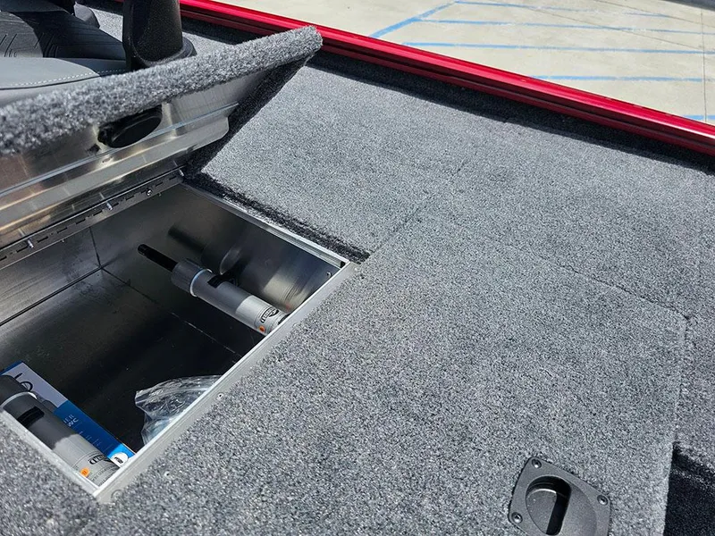 Slide: The Image of 2025 Tracker Pro 170 boat storage compartment with open lid, showcasing interior space. - 16