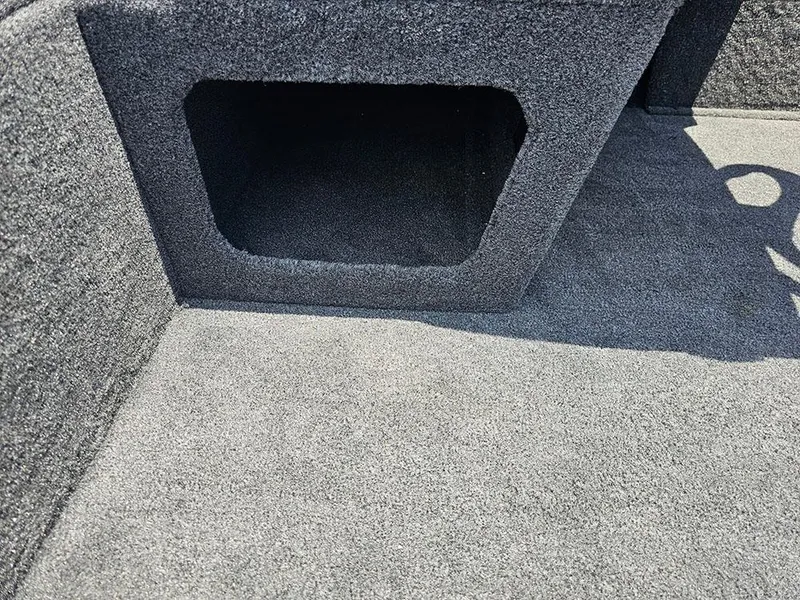Slide: The Image of Carpeted interior of 2025 Tracker Pro 170 boat, featuring storage compartment. - 18