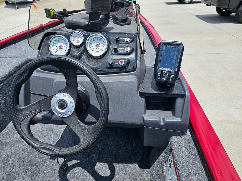 Slide: The Image of 2025 Tracker Pro 170 boat dashboard with steering wheel and gauges. - 20