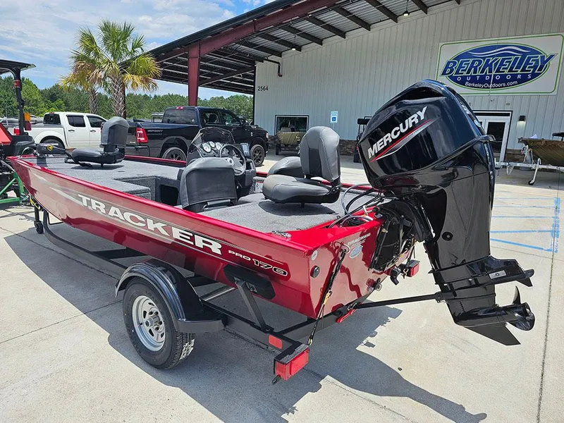 Slide: The Image of 2025 Tracker Pro 170 boat with Mercury engine, parked outside Berkeley Outdoors. - 3
