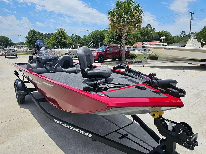 Slide: The Image of 2025 Tracker Pro 170 boat on trailer, red exterior, parked outdoors. - 5