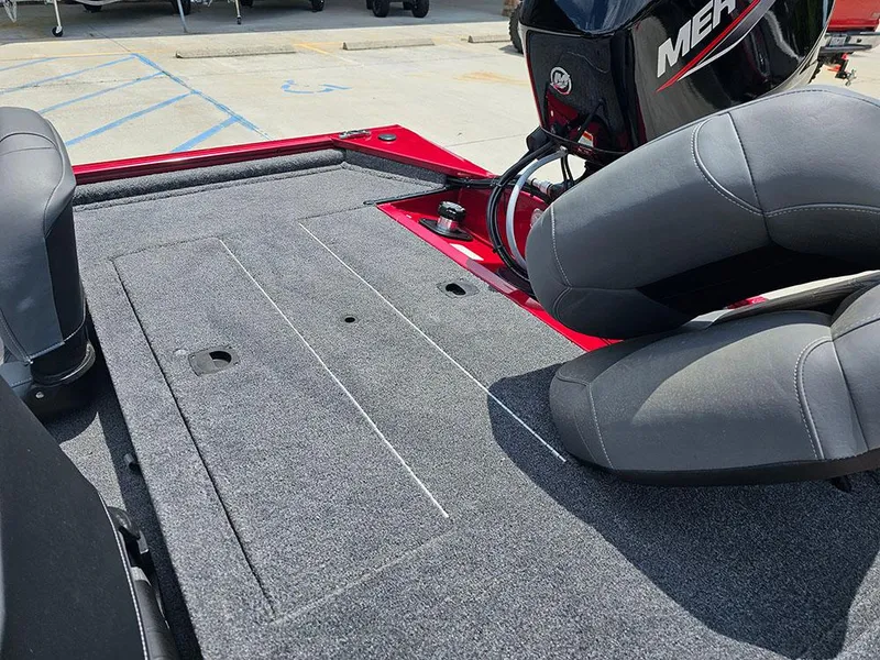 Slide: The Image of 2025 Tracker Pro 170 boat interior with gray seating and carpeted deck. - 9