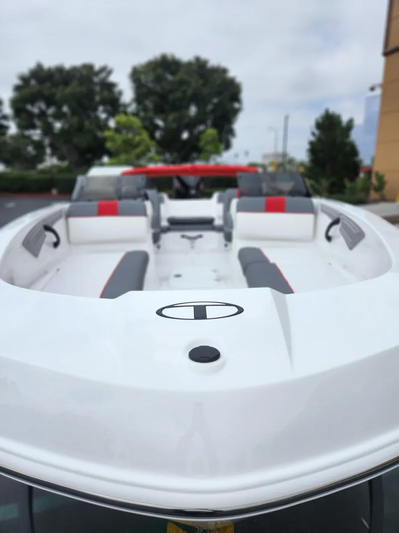 Slide: The Image of 2025 Tahoe T21 boat with sleek white design and modern seating. - 4