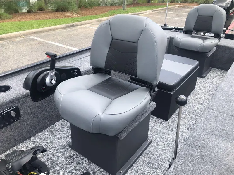 Slide: The Image of 2025 Tracker Panfish 17 boat interior with gray seating and control panel. - 10