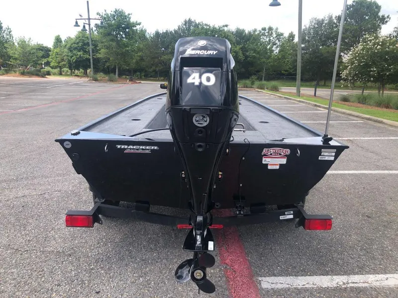 Slide: The Image of 2025 Tracker Panfish 17 boat with Mercury 40 engine in parking lot. - 2