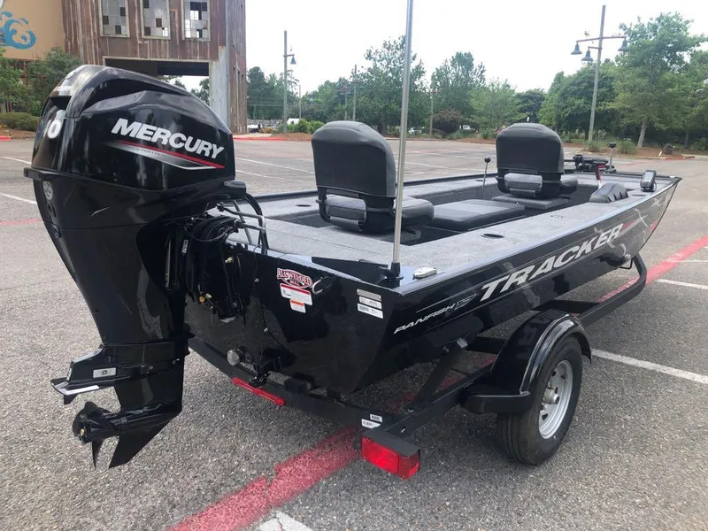 Slide: The Image of 2025 Tracker Panfish 17 boat with Mercury engine in parking lot. - 4