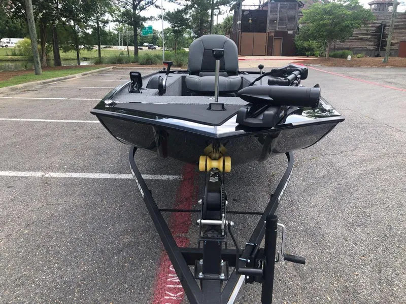 Slide: The Image of 2025 Tracker Panfish 17 boat on trailer in parking lot. - 7