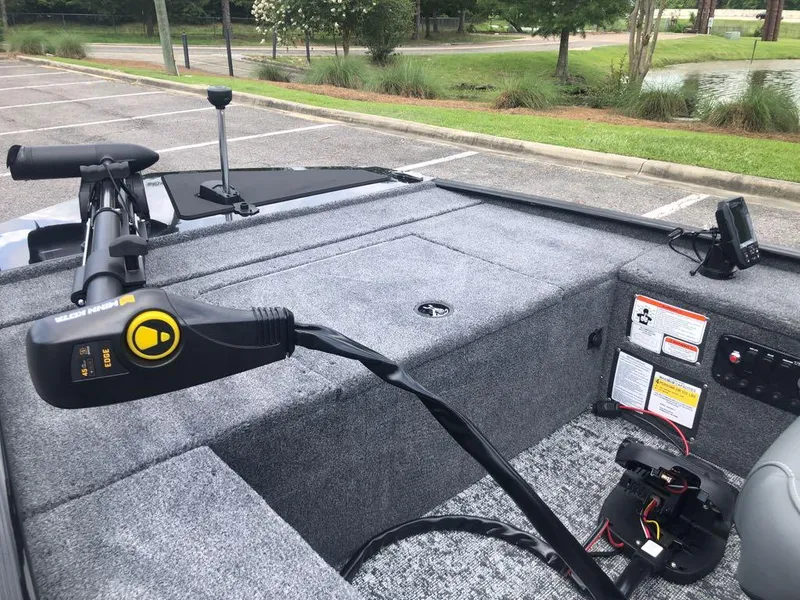 Slide: The Image of 2025 Tracker Panfish 17 boat interior with trolling motor and control panel. - 9