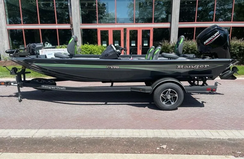 The Image of 2025 Ranger RT178 boat with trailer, parked outdoors, featuring a sleek black design. - 0