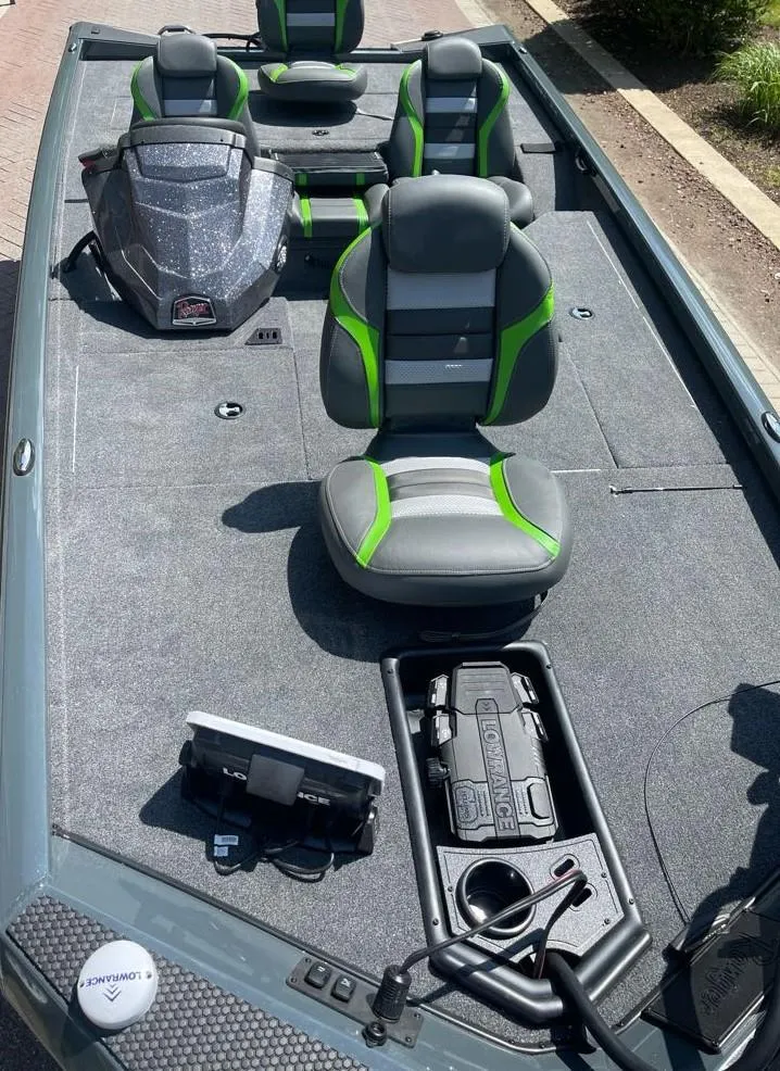 Slide: The Image of 2025 Ranger RT178 boat interior with green-accented seats and Lowrance electronics. - 4