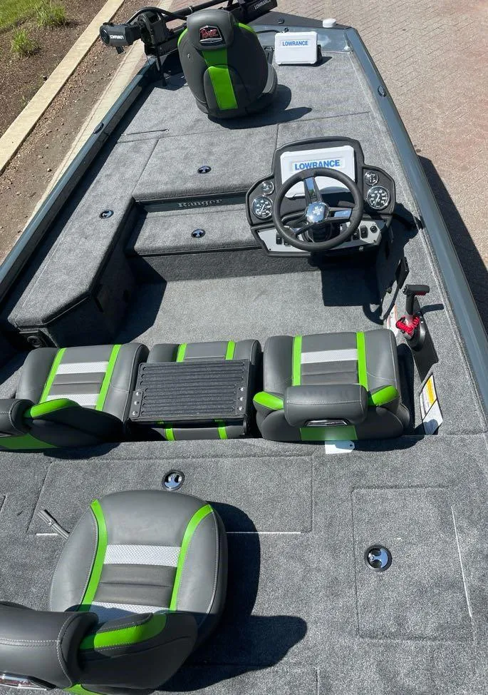 Slide: The Image of 2025 Ranger RT178 boat interior with green-accented seats and Lowrance electronics. - 5