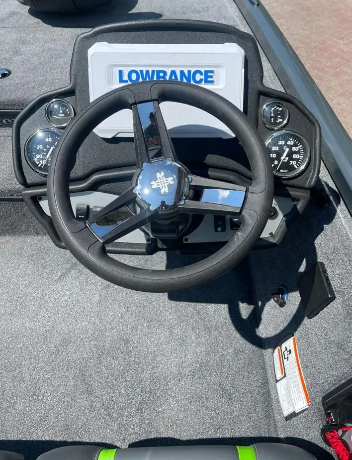 Slide: The Image of 2025 Ranger RT178 boat dashboard with Lowrance display and steering wheel. - 6