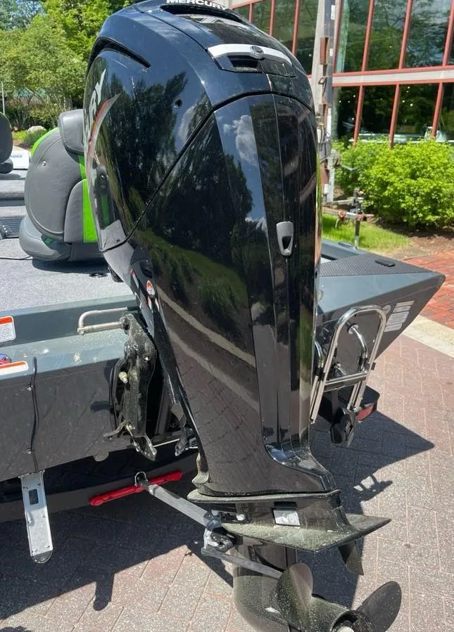 Slide: The Image of 2025 Ranger RT178 boat with Mercury outboard motor, parked outdoors. - 7