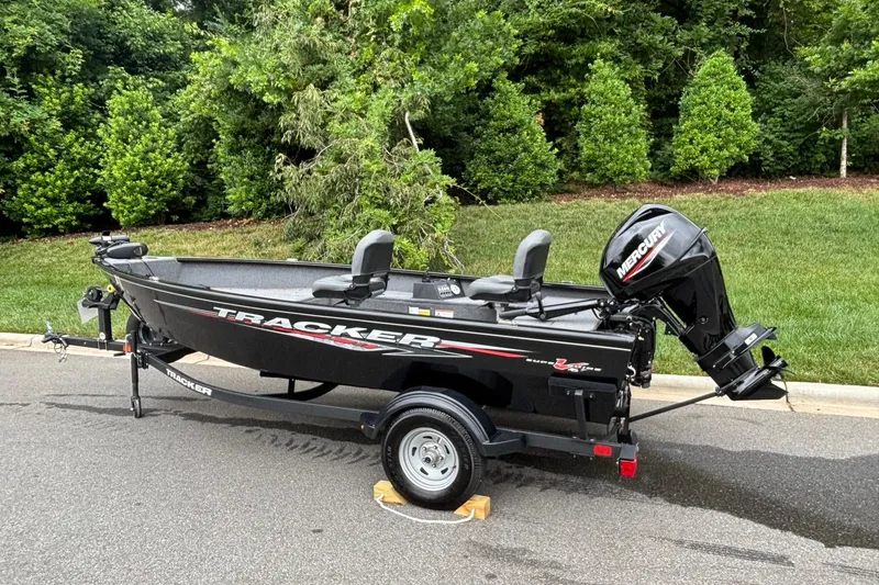 Slide: The Image of 2025 Tracker Super Guide V-16 T boat with Mercury engine on trailer. - 3