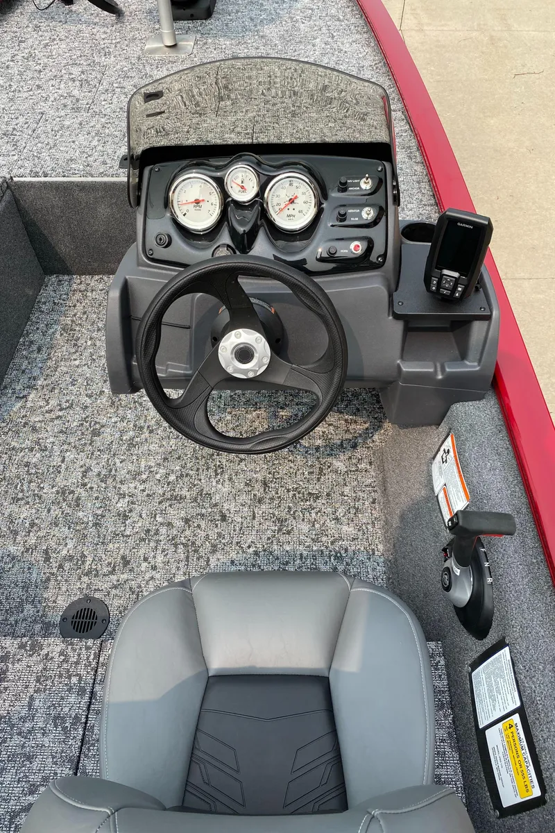 Slide: The Image of 2025 Tracker Pro 170 boat dashboard with steering wheel and gauges. - 5